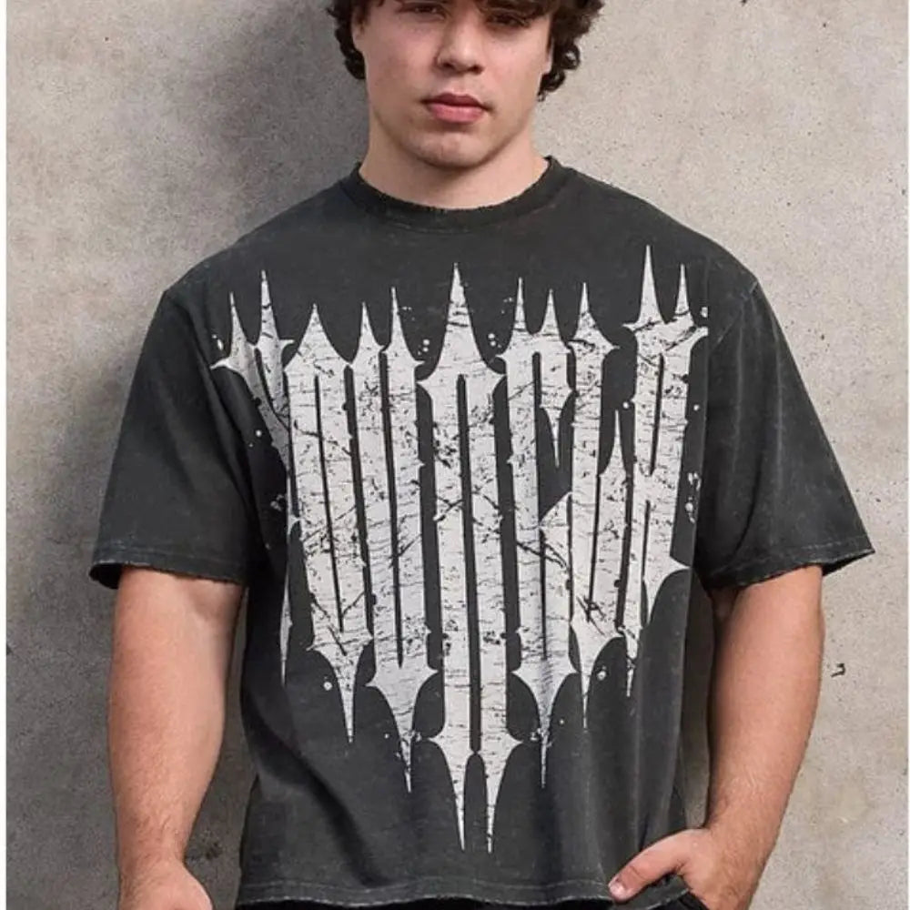 Active Comfort Tee™ worn by a young man standing against a concrete wall, showcasing its stylish and comfortable design.